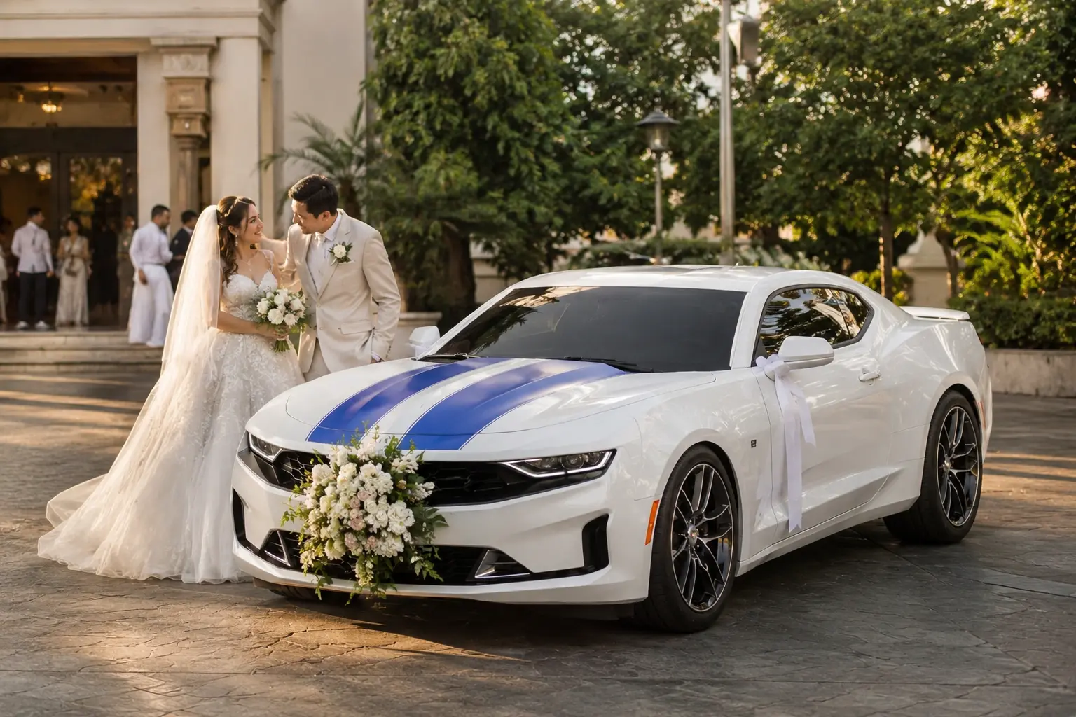 Real wedding arrival with the white Camaro RS bridal car outside a church